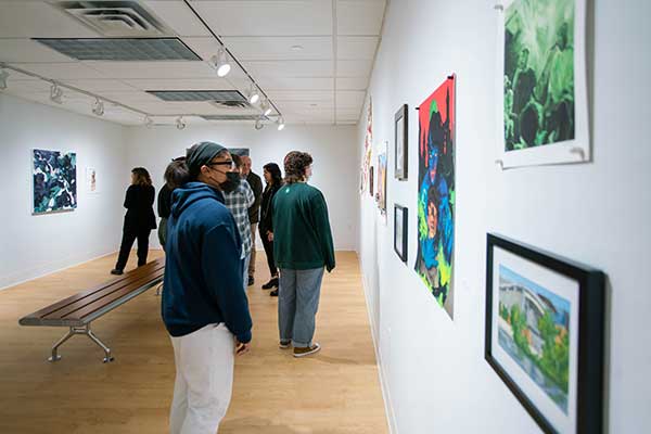 Students admiring art at the Spark Gallery