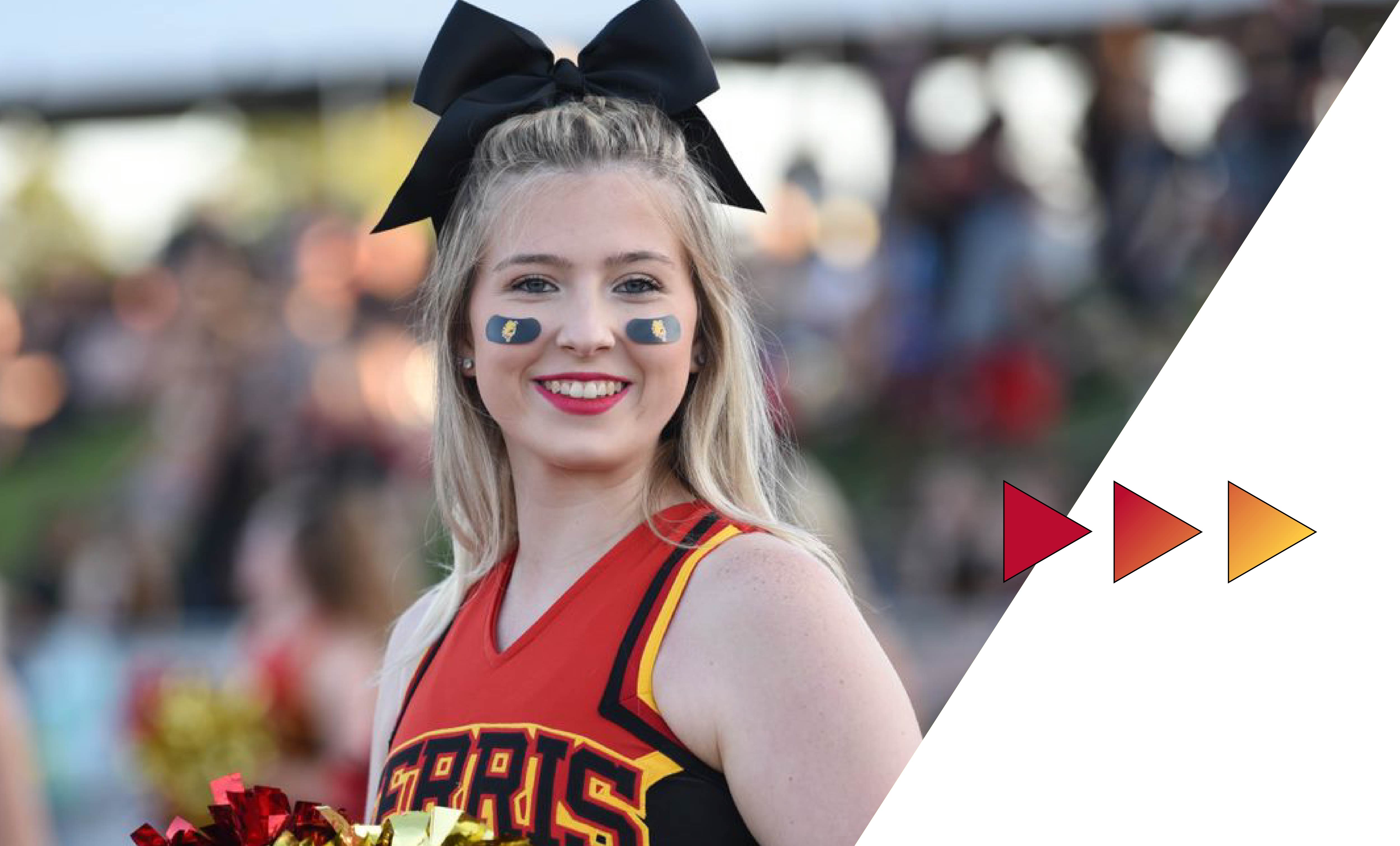 Ferris State cheerleader on the sideline at a football game