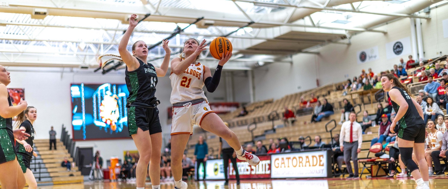 Blanchard attempting a driving layup against a Parkside defender