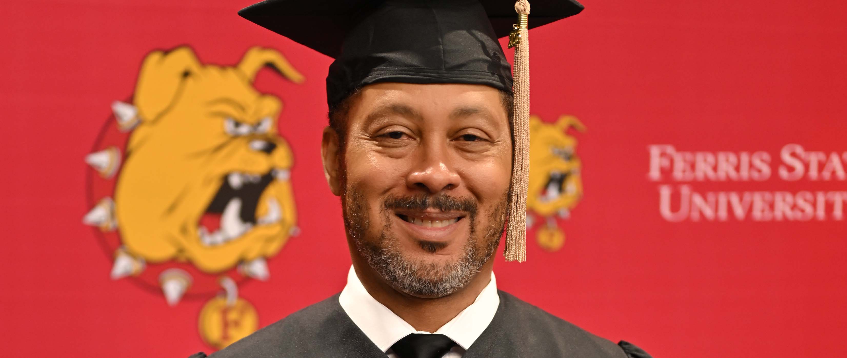 Deron Jackson in his cap and gown at spring commencement 2026.