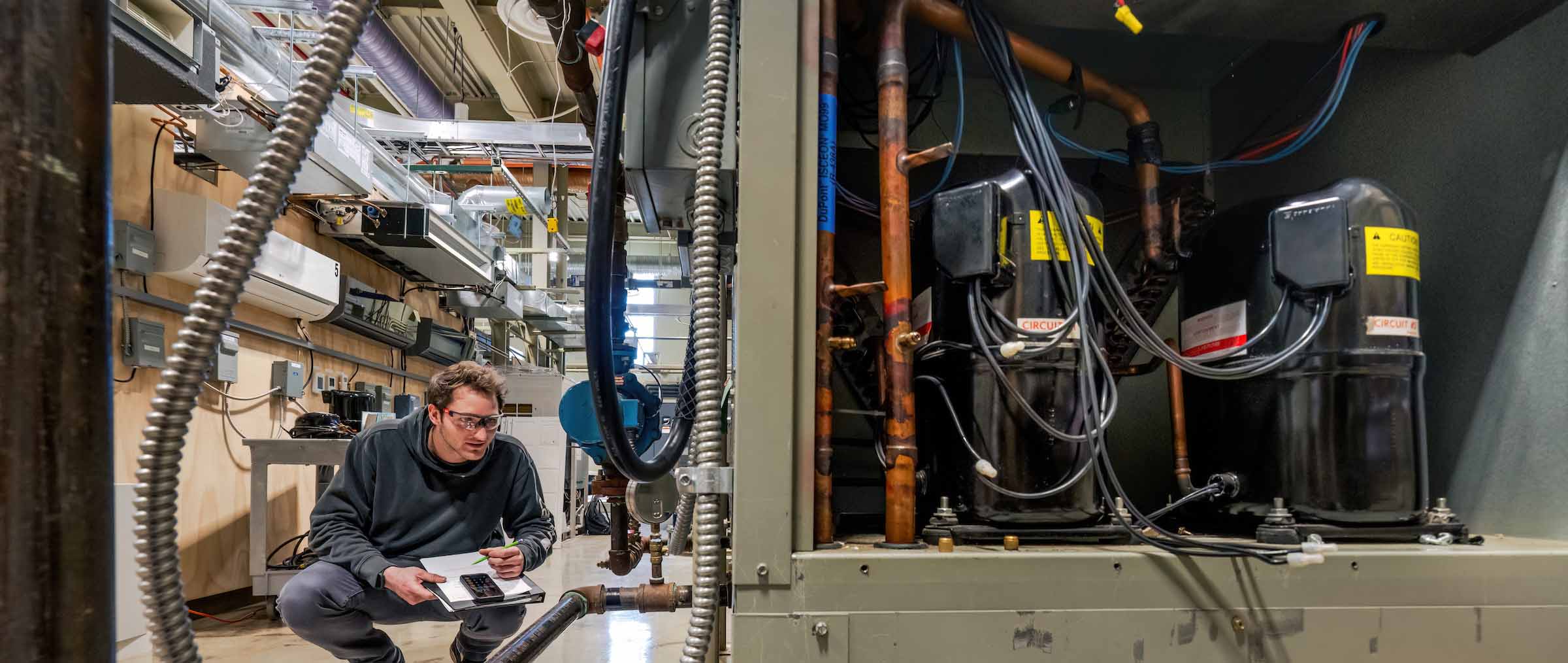 Students getting hands-on HVACR experience at Ferris State University's College of Engineering Technology.