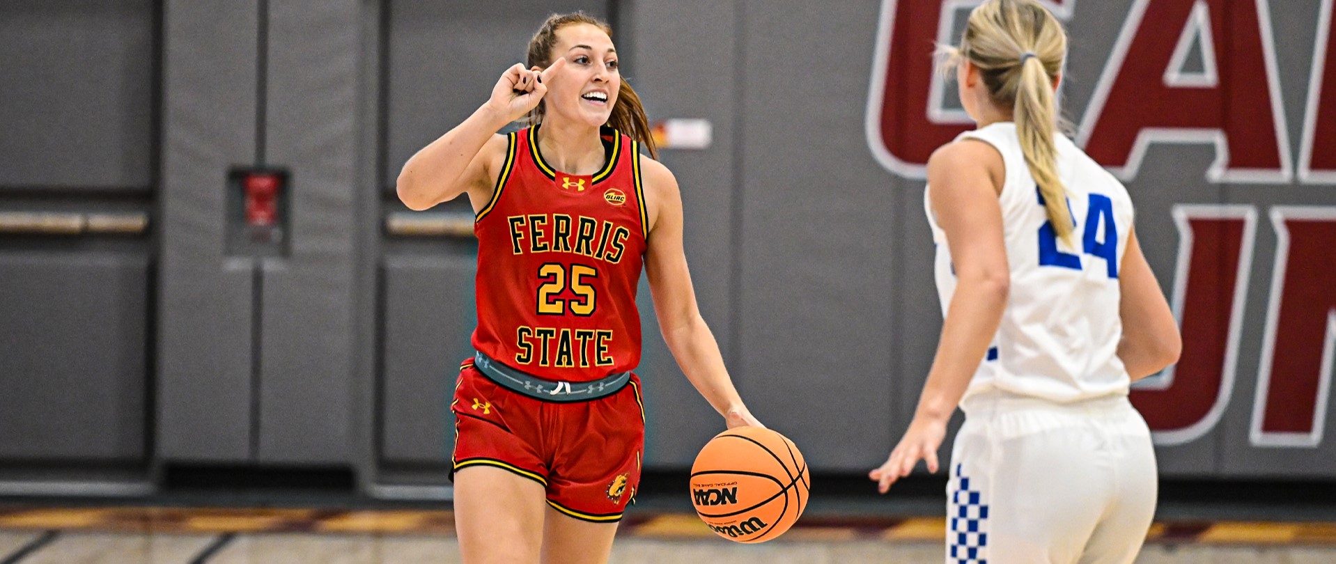 Mia Riely dribbling the ball.