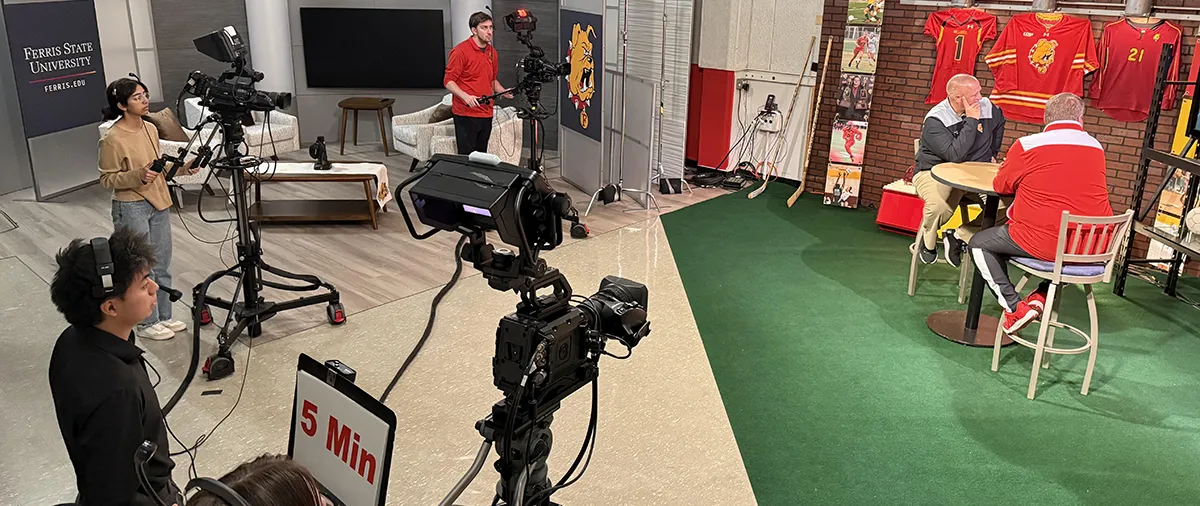 students filming a sports show
