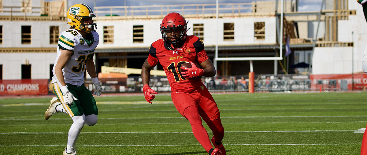 Player running with the football.
