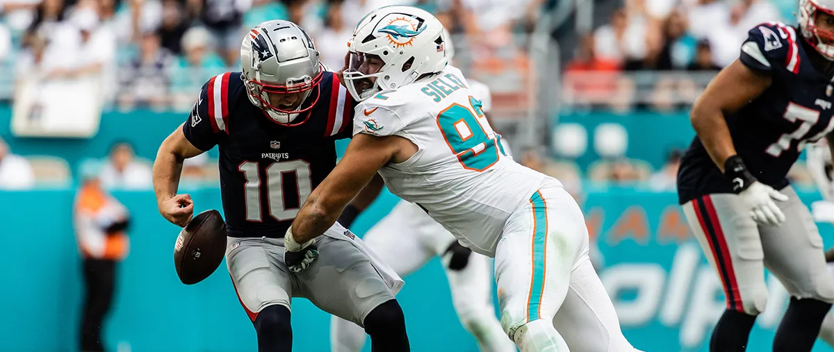 football player tackling the opposition