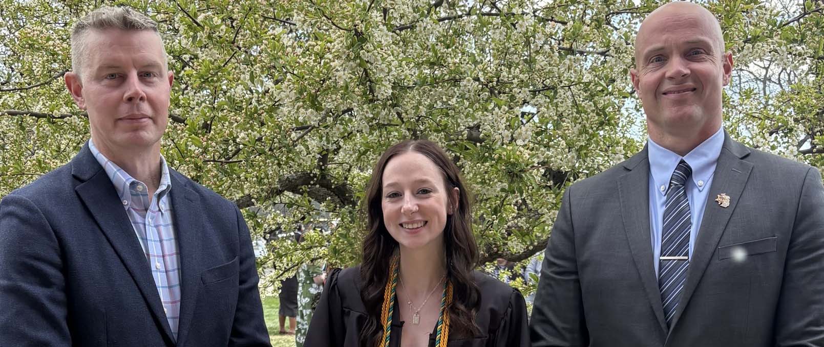 Ingham County Sheriff's Office Captain Chauncey Shattuck, Deputy and 2026 Ferris State graduate Alanna Knopf, and Captain Andrew Daenzer at spring commencement.