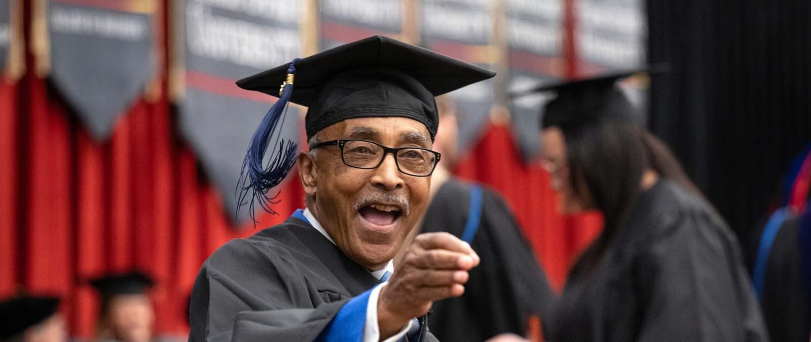 Leroy Harris celebrating during commencement