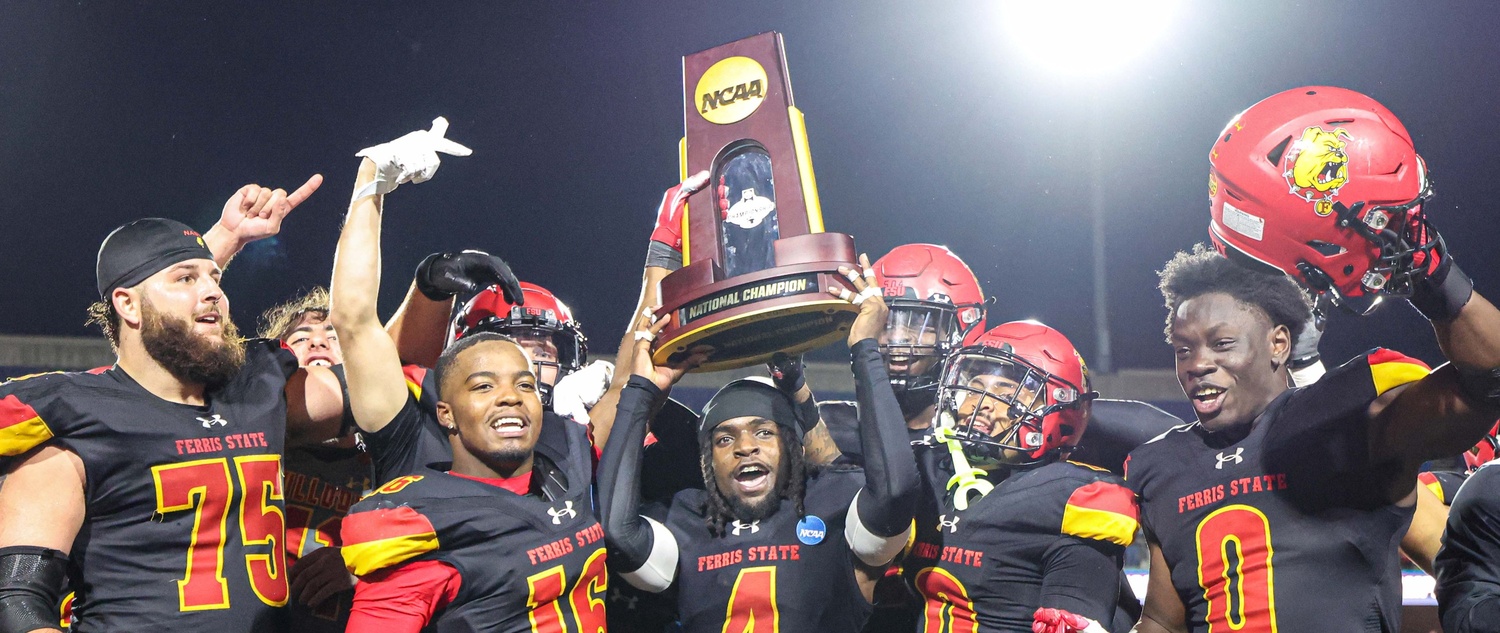 Players hoisting the NCAA Title trophy after the 2025 victory