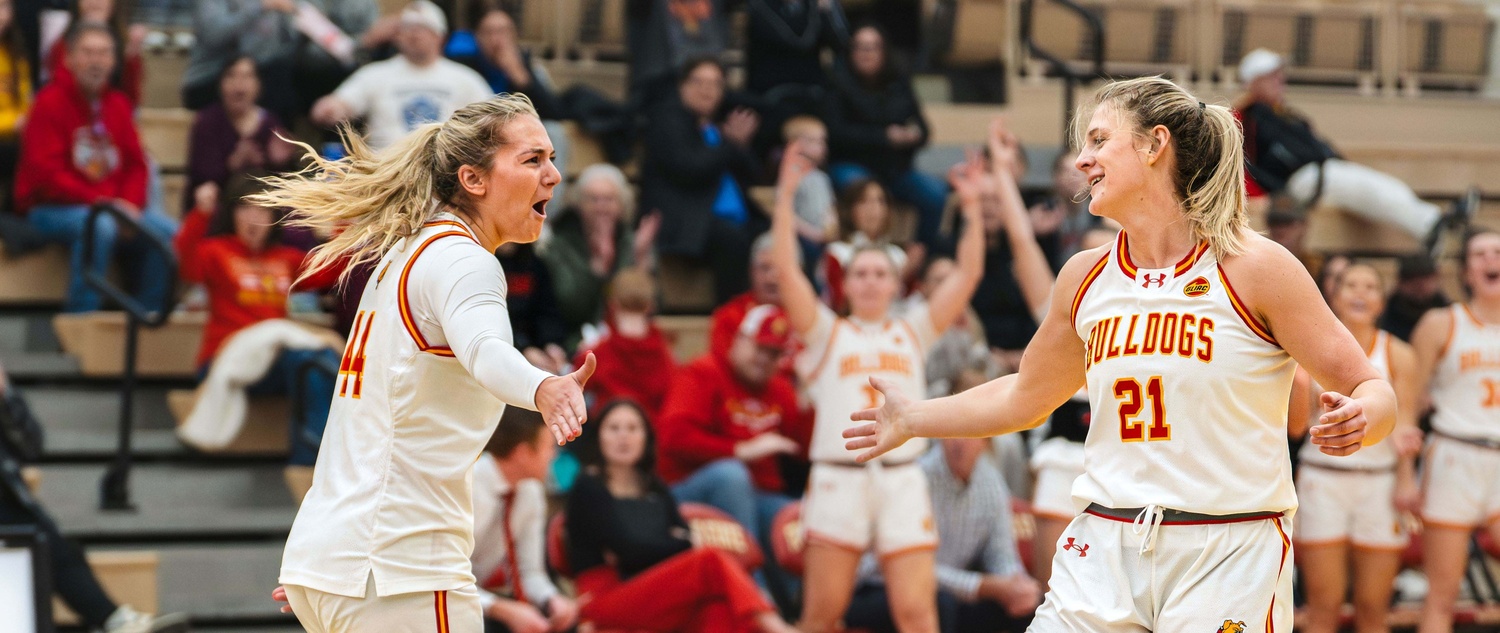 Hiram (left) and Blanchard celebrating a three-point bucket during a contest