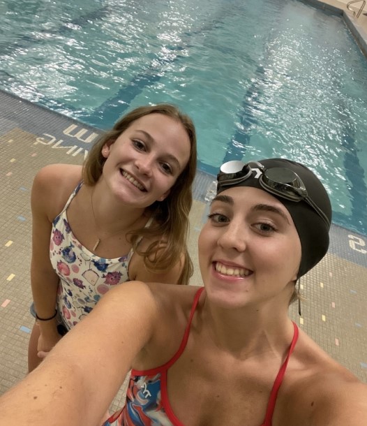 Swimmers posing together