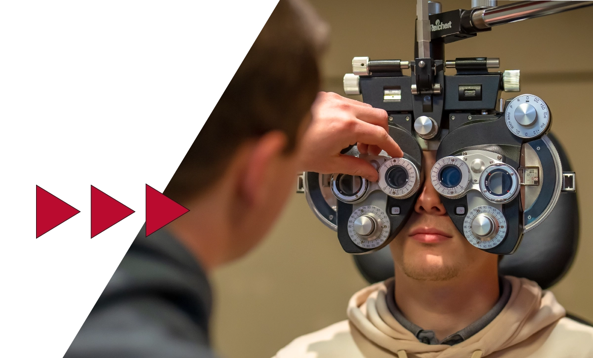 Students interacting with equipment at Ferris State's Michigan College of Optometry