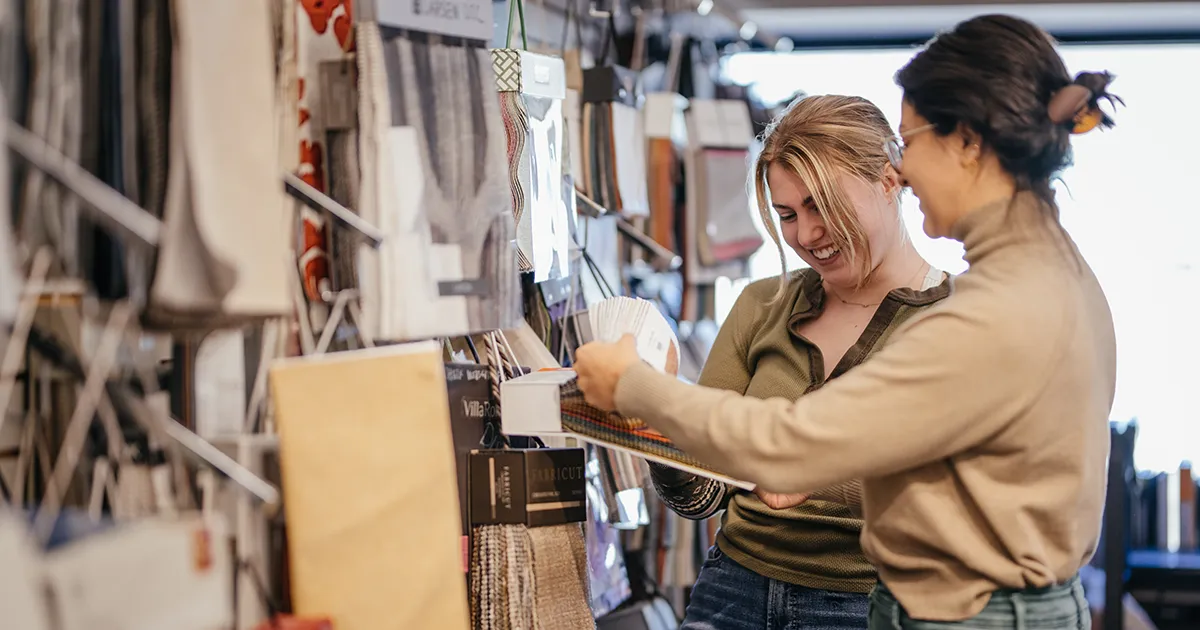 students looking at interior design samples